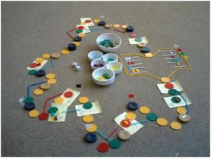 One of the earlier mock-ups of Poseidon’s Wrath. Casino chips and plastic sticks proved to be useful for flexible prototyping and playtesting. 